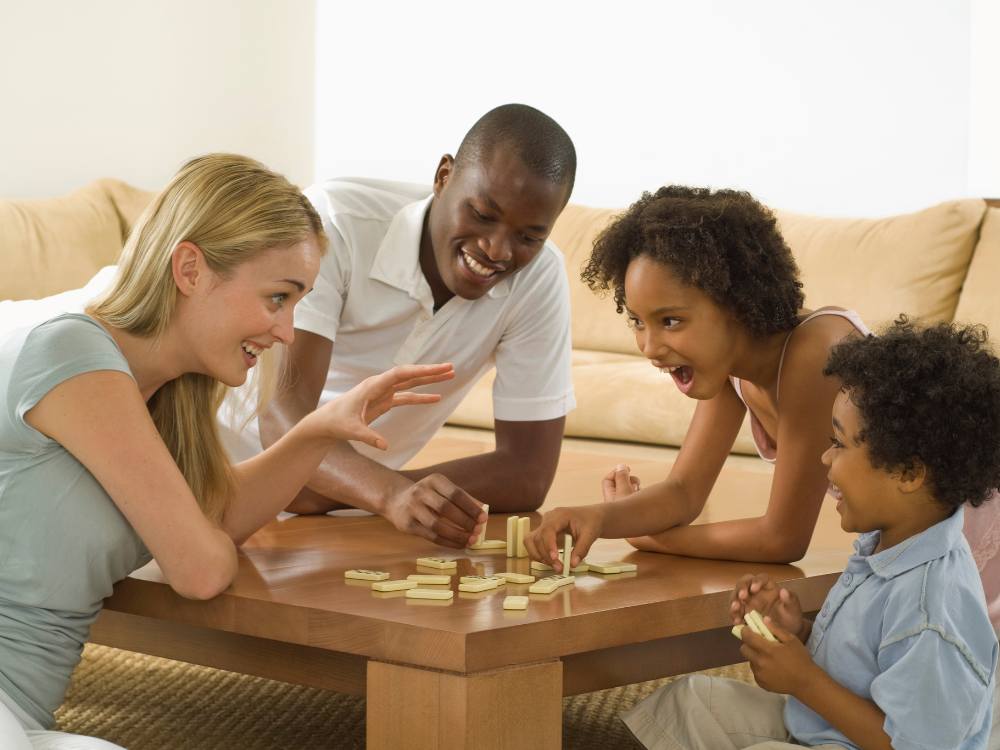 Diverse family playing games together and laughing